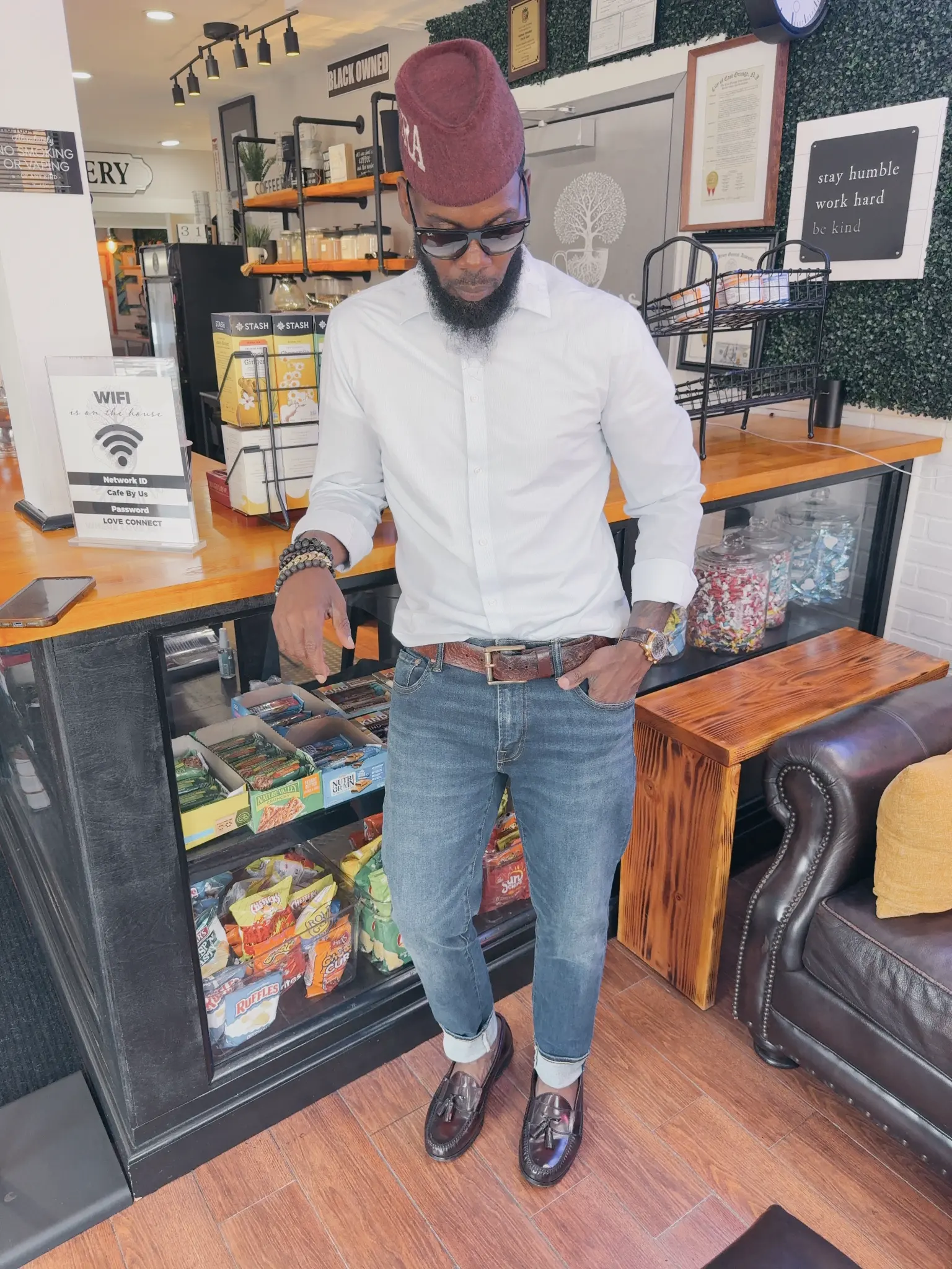 Samuel Breaker in his cafe, showcasing the community space he created