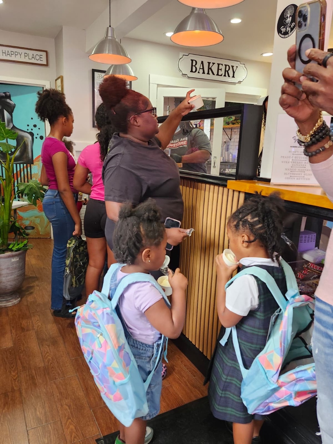Kids enjoying ice cream inside Cafe By Us