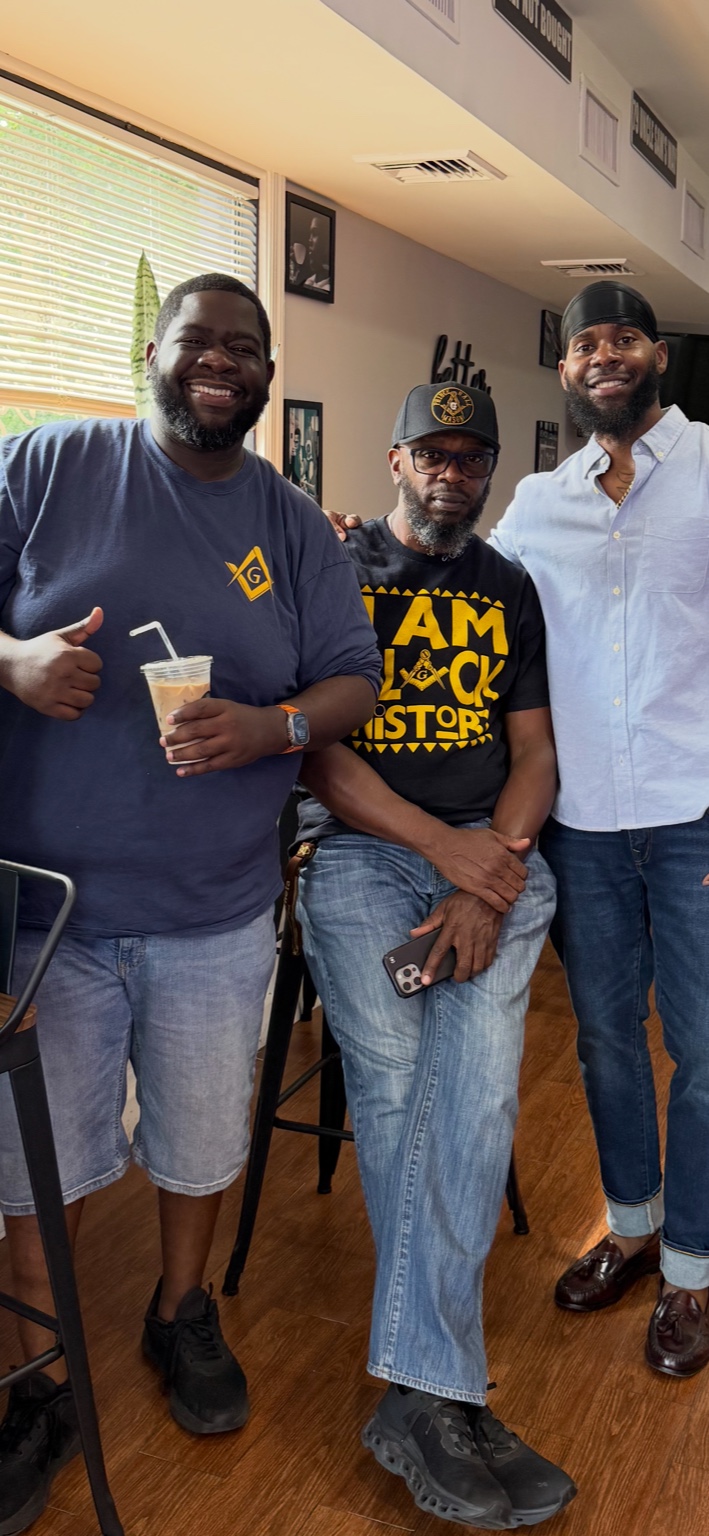 Friends smiling inside Cafe By Us