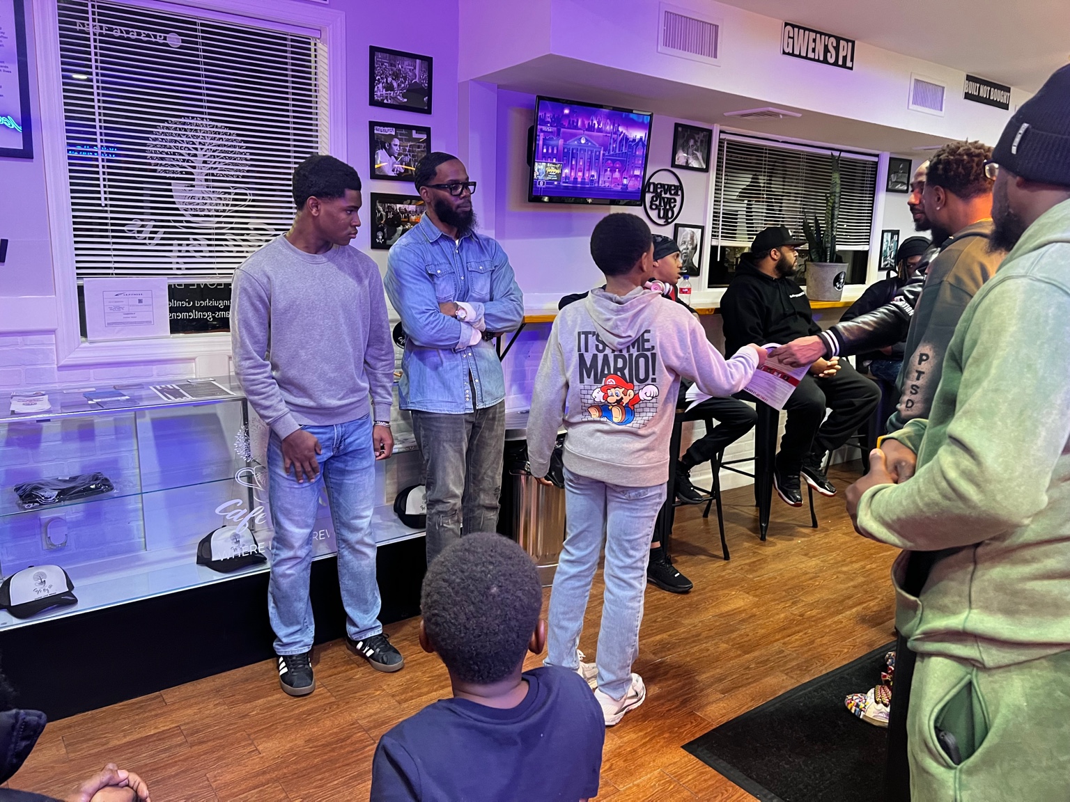 Group photo with guests at Cafe By Us