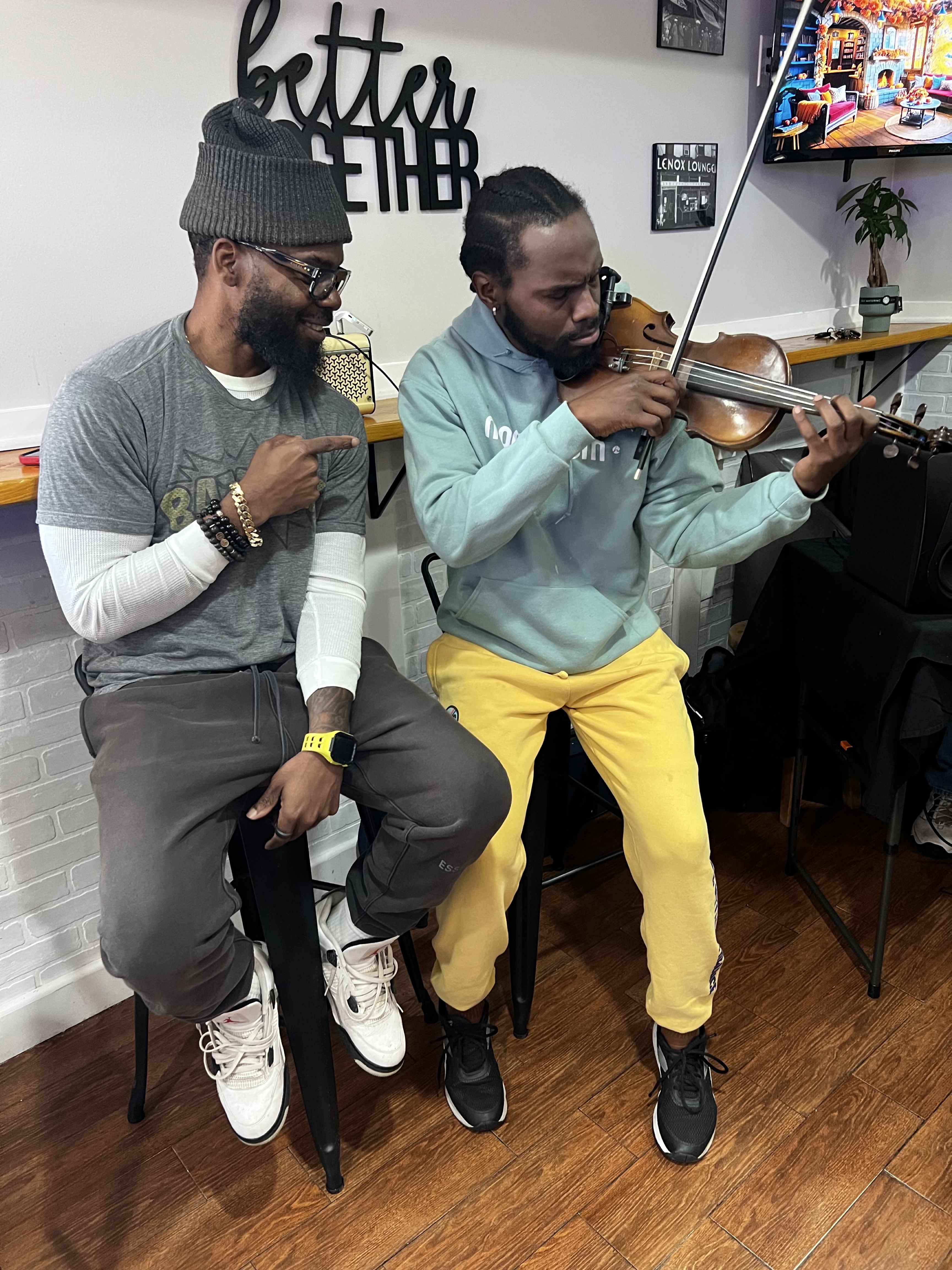 Large community gathering inside Cafe By Us